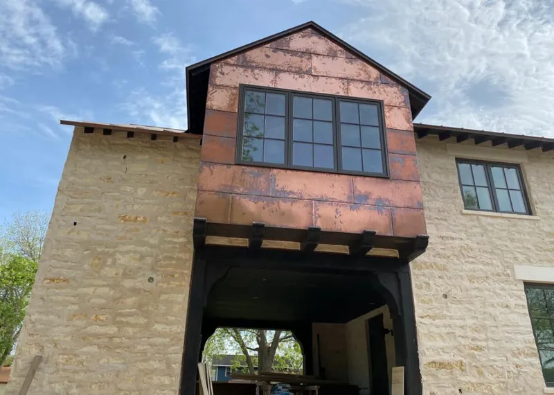 Copper metal panel facade on a stone building for Skylight Installation in Henderson